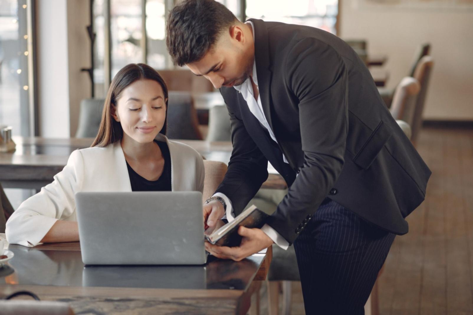 Financial planning documents and calculator showing investment strategy development